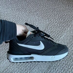 Black women’s Nike sneakers